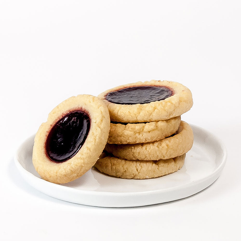 Blackberry tarts on a white tray