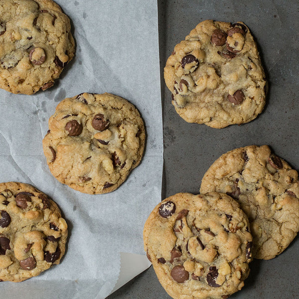 Chocolate chip walnut cookies on a concrete countertop
