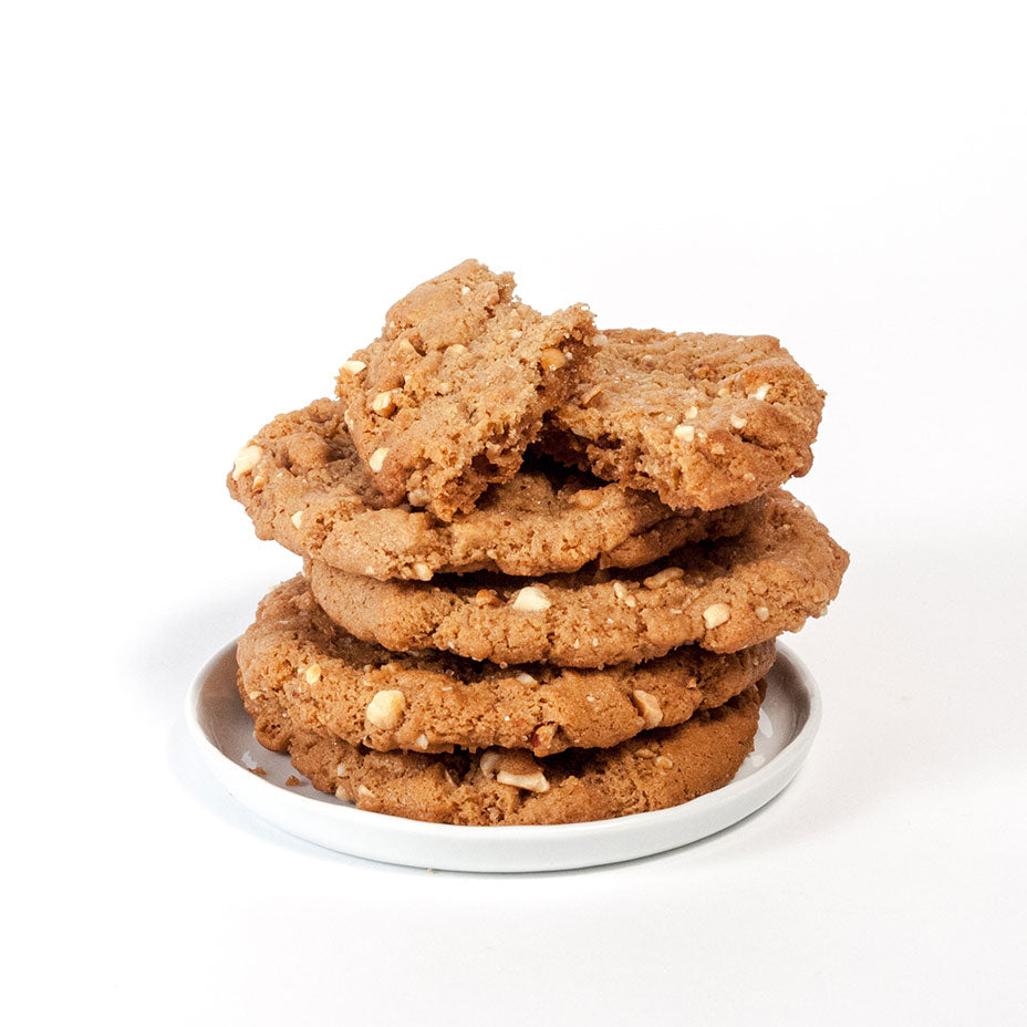 Peanut butter cookies stacked on a white plate
