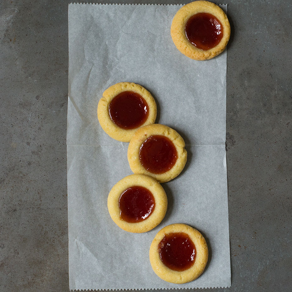 Strawberry tarts on a concrete countertop
