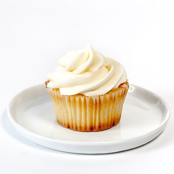 Vanilla cupcake on a white plate