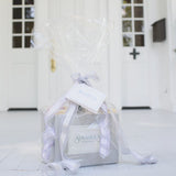 Sugaree’s gift basket with silver ribbon and 'Sugaree's' label pictured on doorstep