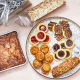 Sugaree’s brownies, tassies, tarts and more on white plate with gift wrap packaging and ribbon