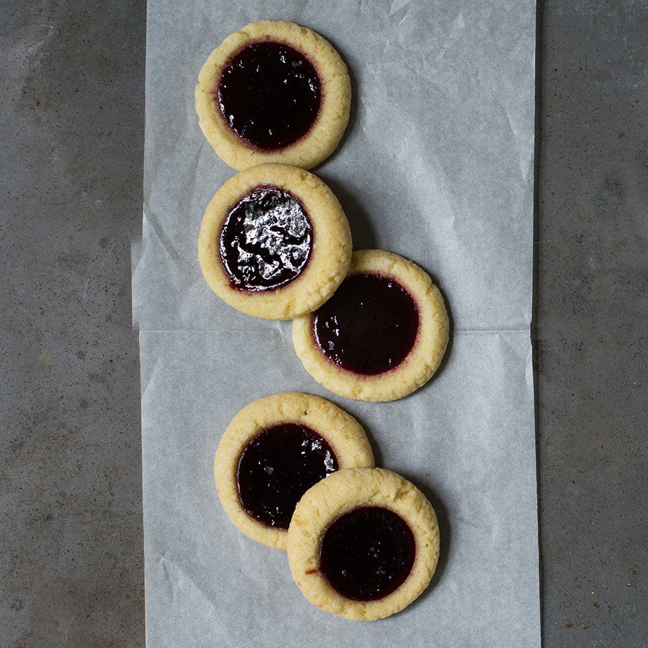 Blackberry tarts on a concrete counter top