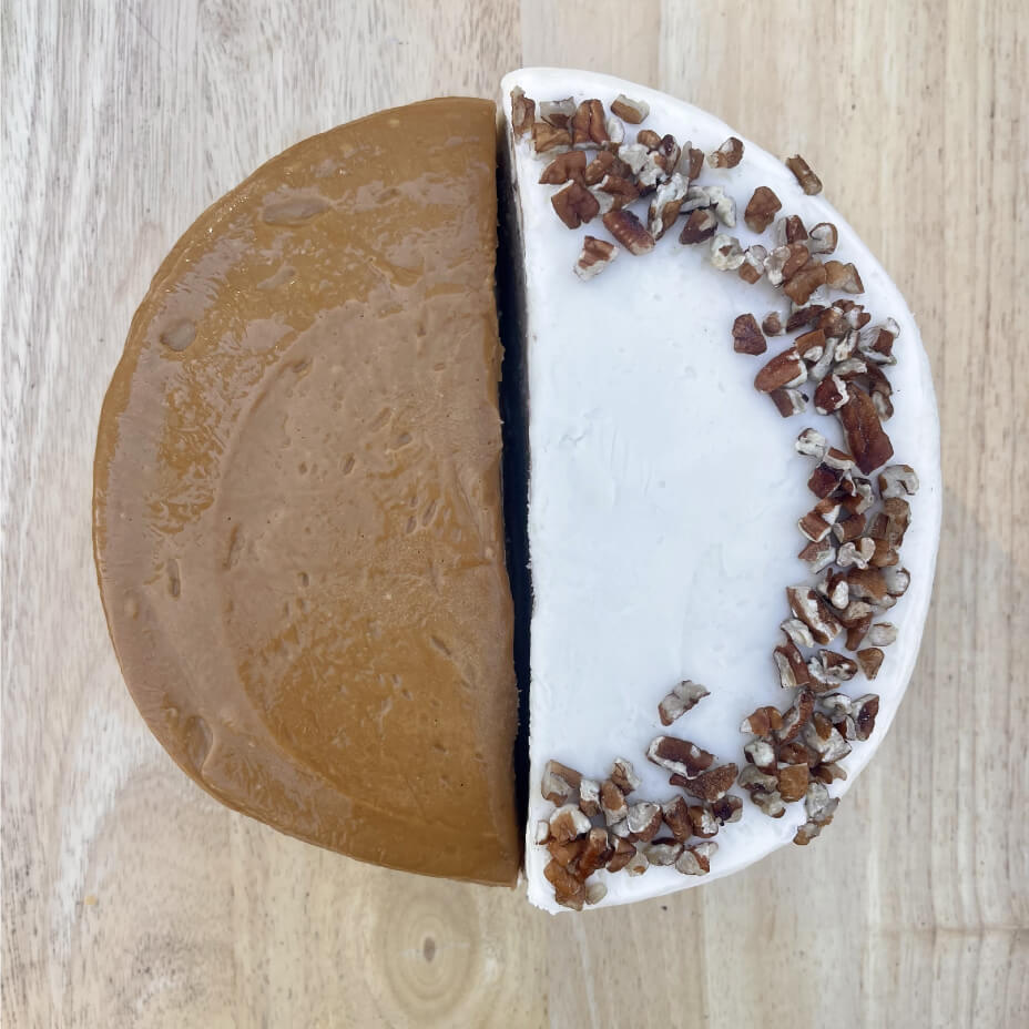 Two cake halves on wooden tabletop