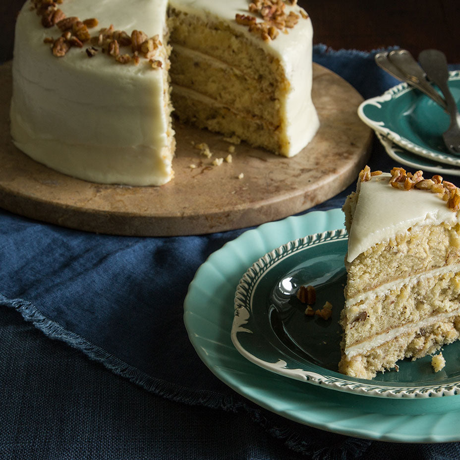 Italian cream cake slices on blue plates