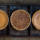 Three pies on a metal tray