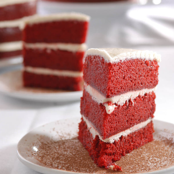 Slices of red velvet cake on plates