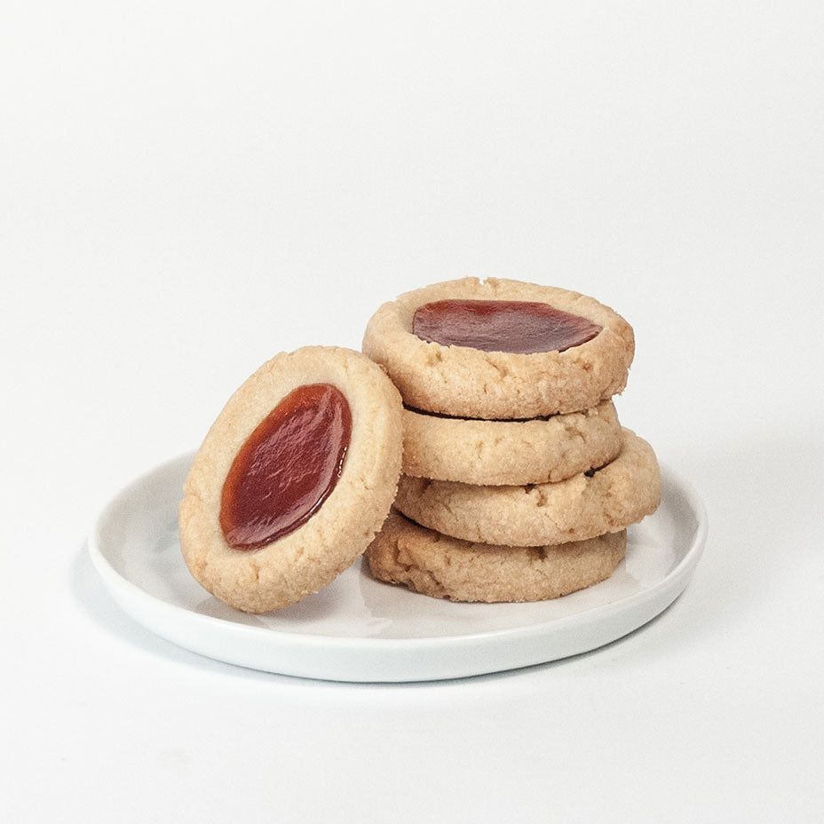 Strawberry tarts stacked on a white plate