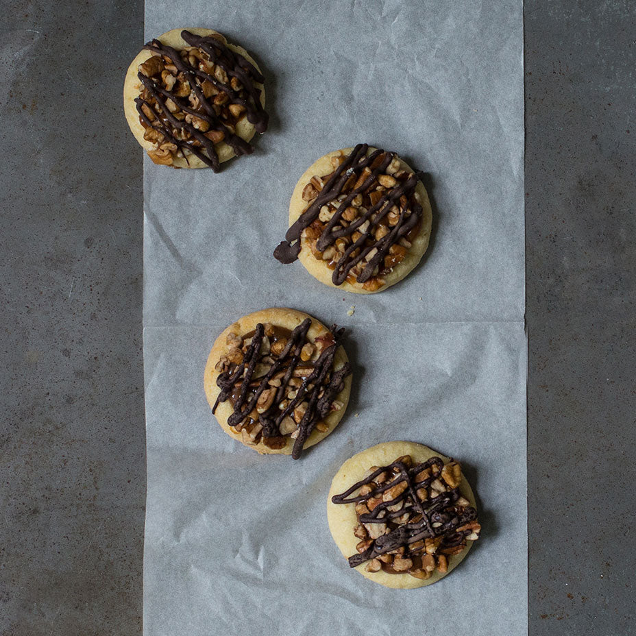 Four turtle tarts on a concrete countertop