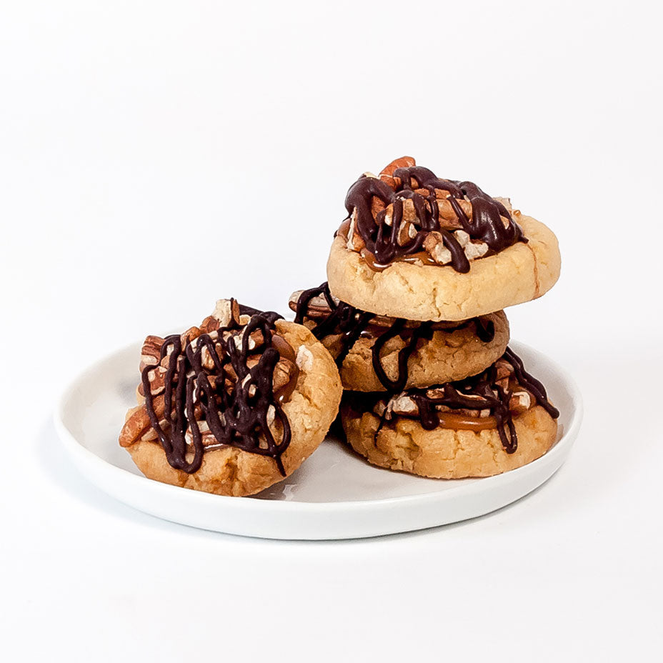 Four turtle tarts on a white plate